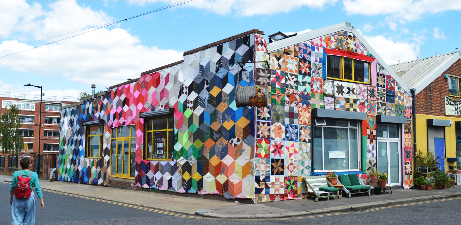 Quilt Club photo of a warehouse covered in a giant quilt